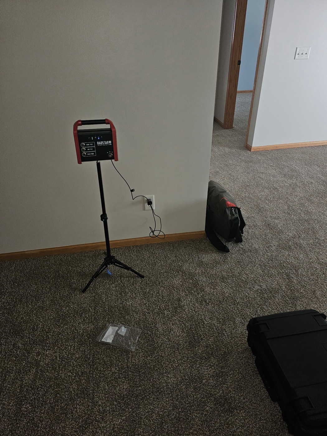 A RadStar continuous radon monitor deployed on a tripod during a radon test