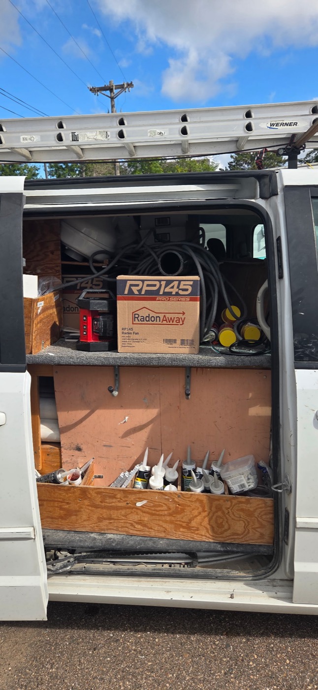 RadonAway RP145 radon mitigation fans and materials stocked in the service van